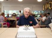 Reg Symons celebrates his 100th birthday at St Basil's Miranda. Picture by Chris Lane