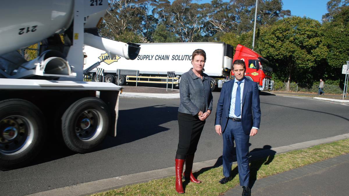 Truck central: Blue Mountains MP Trish Doyle and Shadow Treasurer Ryan Park in between two trucks at the Macquarie Road/Hawkesbury Road roundabout.
