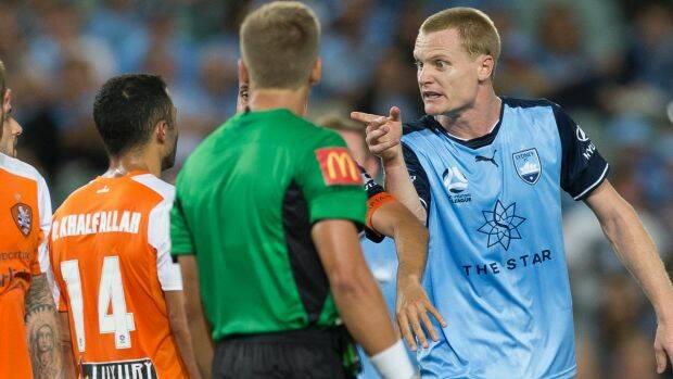 Look at the screen: Sydney FC players point to the replay after a scuffle broke out following the spitting incident. Photo: AAP