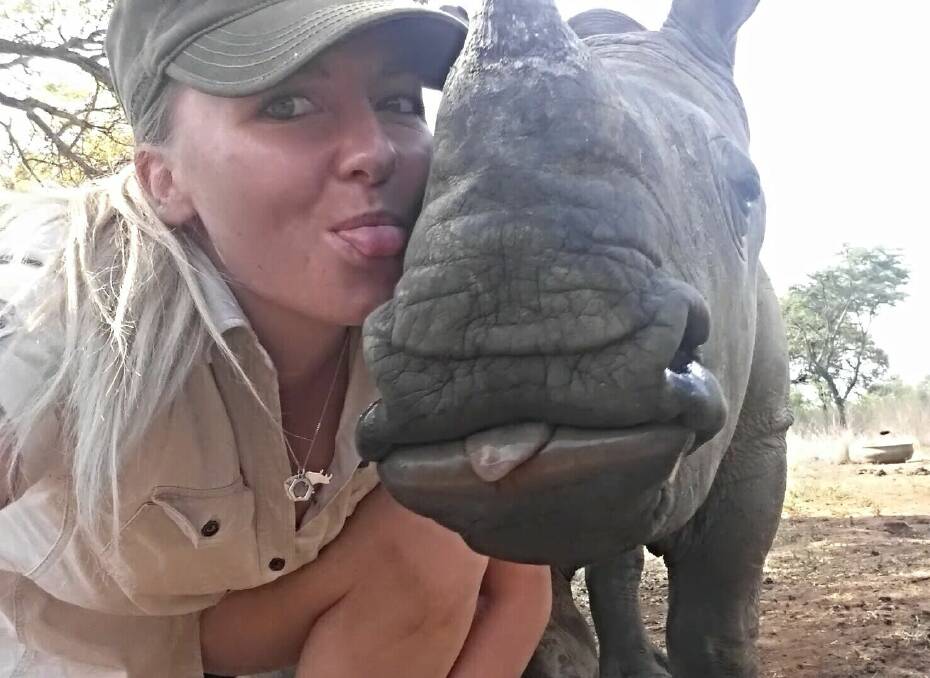 Laura Ellision is passionate about the conservation of rhinos in the wild and says unfortunately poaching is on the rise. Here she sticks her tongue out with Kabelo. 