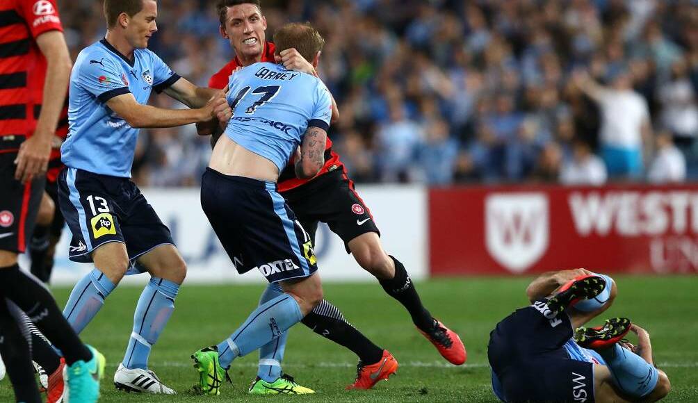 David Carney of Sydney FC clashes with Scott Neville of the Wanderers after Robbie Cornthwaite of the Wanderers tackled Bobo of Sydney FC during the round one A-League match between the Western Sydney Wanderers and Sydney FC at ANZ Stadium on October 8, 2016 in Sydney, Australia. (Photo by Ryan Pierse/Getty Images)