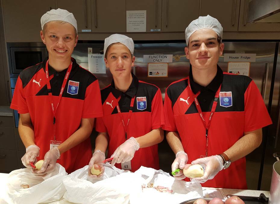 A-PEELING TEAM: Junior soccer players Ante Furjanic, Darian Daghero and Braith Foxe during a team night at Westmead's Ronald McDonald House. Picture: Christian Layland