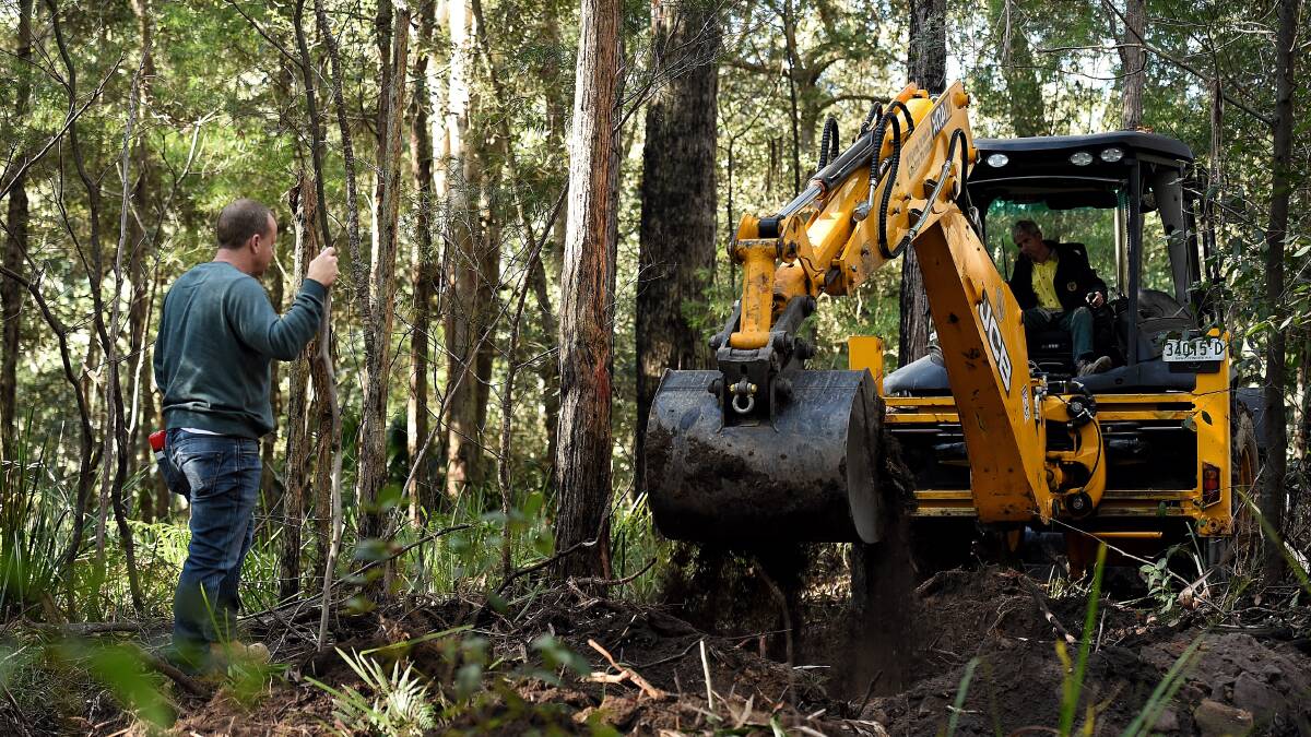Fresh search: The digging resumes at the search area for the burial site of Matthew Leveson in the Royal National Park at Waterfall. Picture: Kate Geraghty
