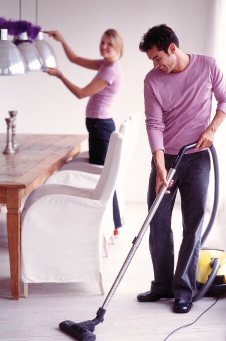 Couple Cleaning Dining Room --- Image by © Royalty-Free/Corbis spring clean, recycle, recycling, clean, cleaning
