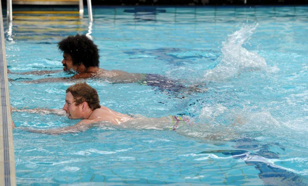 Henry Speight (top) and David Pocock, swimming as part of their rehabilitation. Photo: Graham Tidy