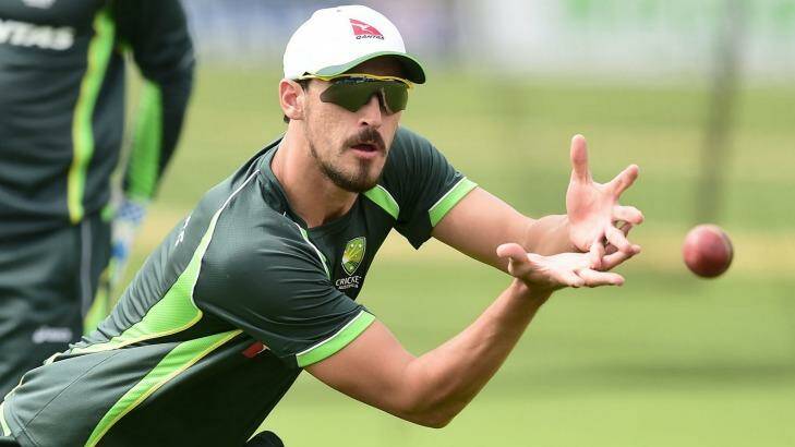 No pink fan: Mitchell Starc catches the ball  during a training session in England. Photo: Adam Davy
