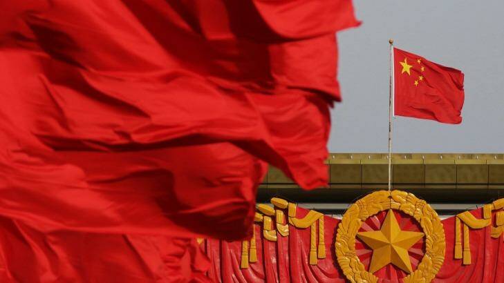 Red flags fly in front of the Chinese national flag, right, at Tiananmen Gate in Beijing ahead of China's annual meeting of the National People's Congress. Photo: Tomohiro Ohsumi