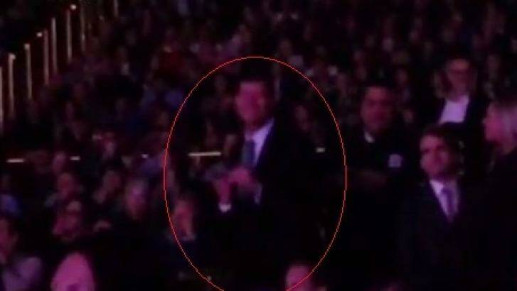 Packer shuffling about as he watches Carey on stage at The Colosseum at Caesars Palace on Tuesday night. Photo: YouTube