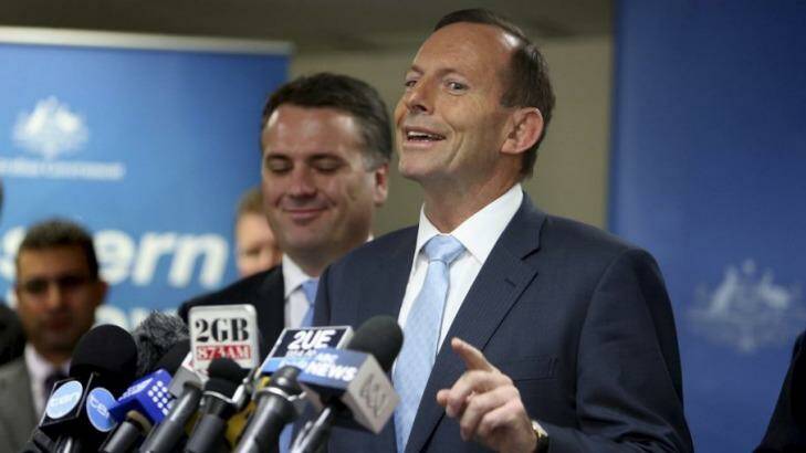 Prime Minster Tony Abbott responds to a journalist's question about "corruption" in the NSW state government. Photo: Sasha Woolley