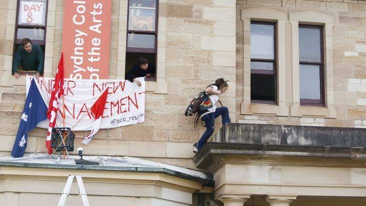 A student climbs to the administration offices of the Sydney College of Arts during a student occupation of the campus in 2016. Photo: Daniel Munoz