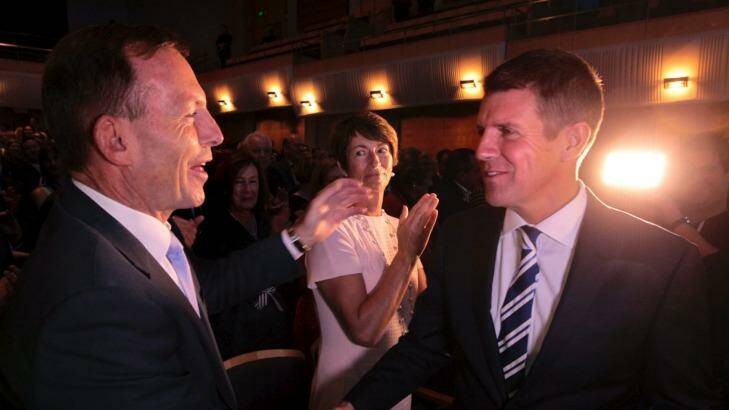 Opposing propositions: Tony Abbott the polariser and Mike Baird the likeable. Photo: Dean Sewell