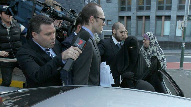 Fatima Elomar, in black, gets into a car following her sentencing on Friday.  Photo: Anthony Johnson