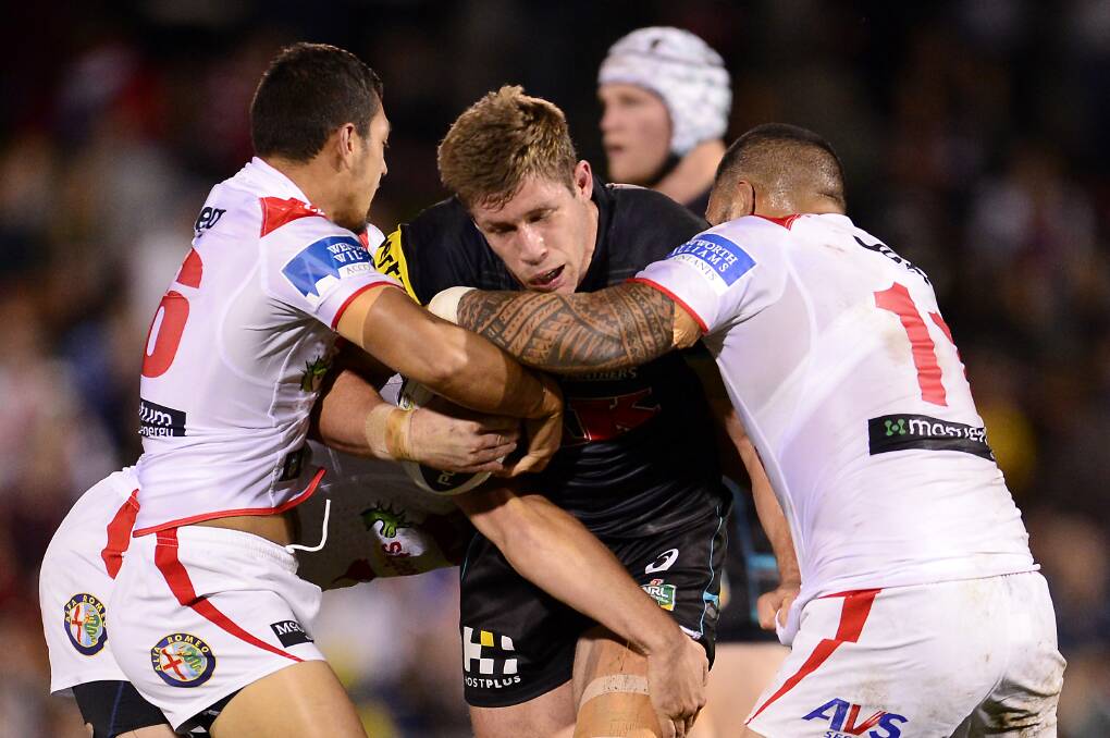 Jeremy Latimore of the Panthers is tackled during the round 14 NRL match between the Penrith Panthers and the St George Illawarra Dragons. Picture: Getty Images