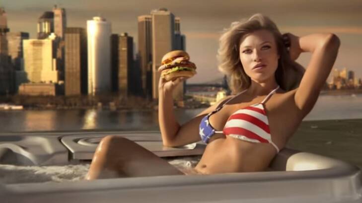 Sports Illustrated model Samantha Hoopes, in a hot tub, advertises the Most American Thickburger. Photo: YouTube