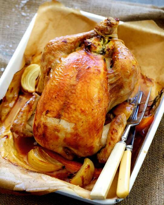 Adam Liaw's classic roast chicken with bread and butter stuffing <a href="http://www.goodfood.com.au/good-food/cook/recipe/classic-roast-chicken-with-bread-and-butter-stuffing-20140324-35d82.html"><b>(recipe here).</b></a> Photo: Edwina Pickles