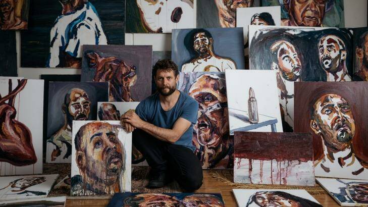 Artist Ben Quilty surrounded by works painted by Myuran Sukumaran, which will be exhibited at Campbelltown Arts Centre as part of the 2017 Sydney Festival. Photo: Daniel Boud