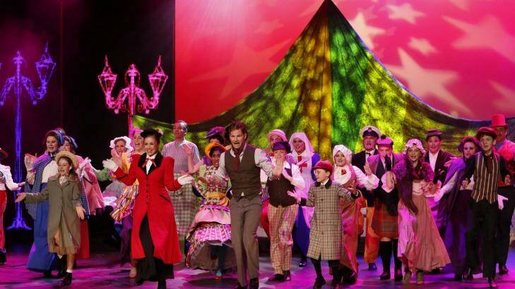 Alinta Chidzey (in red) as Mary Poppins and Shaun Rennie (in brown, with neckscarf) as Bert.  Photo: Family Fotographics