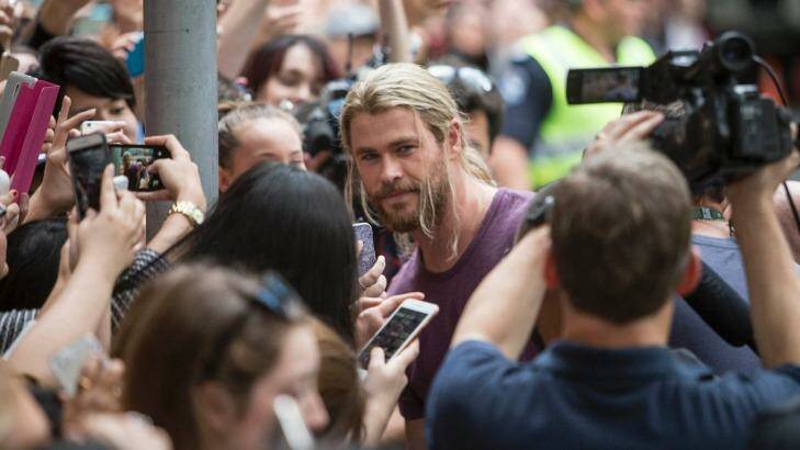 Hemsworth is mobbed by fans on the streets of Brisbane. Photo: Glenn Hunt