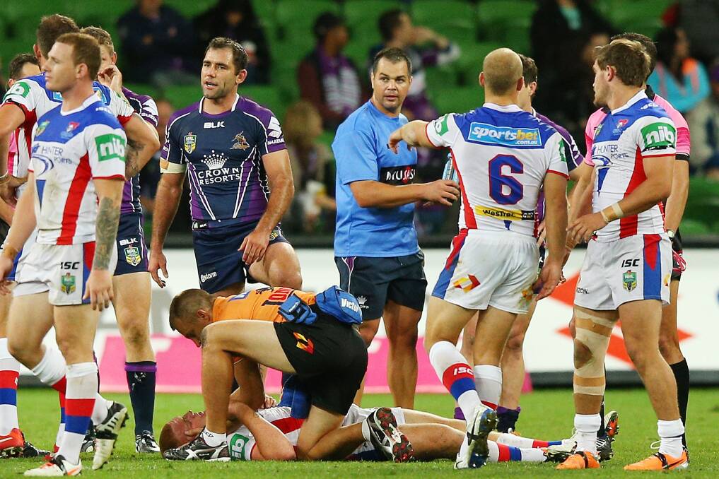 Tackle gone wrong:  Alex McKinnon of the Knights lays on the ground after being tackled during the round three NRL match between the Melbourne Storm and the Newcastle Knights at AAMI Park. Picture: Michael Dodge/Getty Images. 