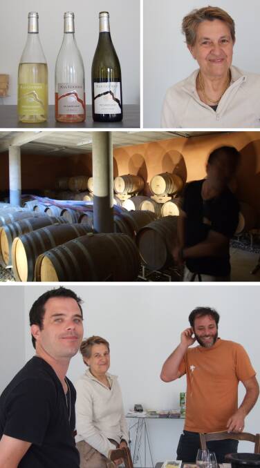 MAS GOURDOU WINERY | Our obliging and friendly host, with three of the bottles we tasted, Coteaux du Languedoc white, Pic Saint-Loup rose and Pic Saint-Loup red and the wine barrels in the cellar beneath the tasting room.