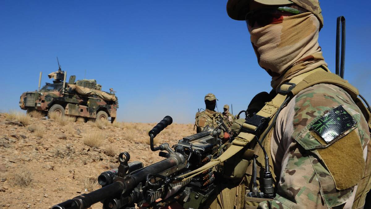 SOTG troops on patrol in Uruzgan province. Photo: CPL CHRIS MOORE