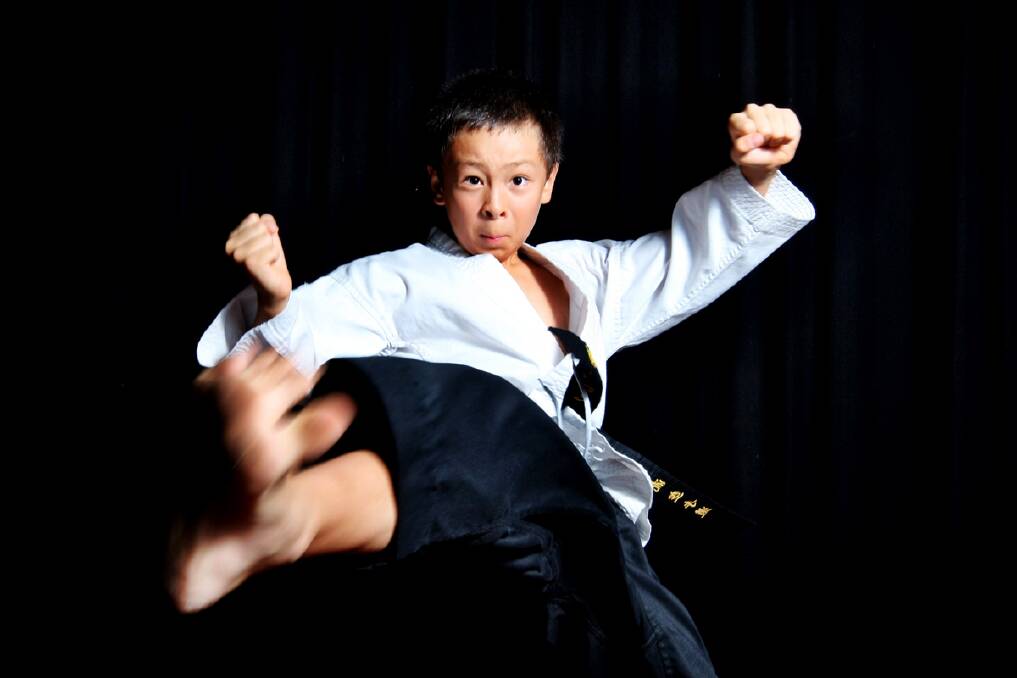 Young Martial Arts talent Hugh Matthews has been winning a stack of titles. Photo: Simon Bennett