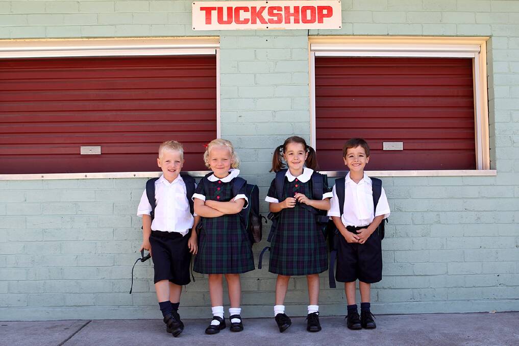 Double the fun: Two sets of twins Kobe and Mia Tait and Grace and Joshua Yacou are starting school at St Finbar's this year. Photo: Jane Dyson