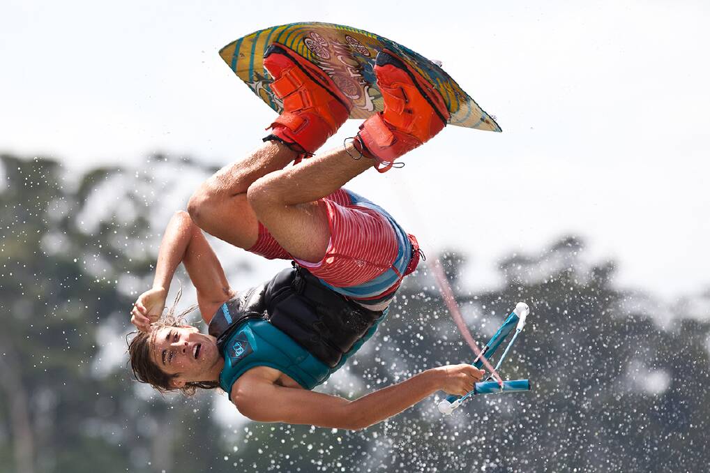 A competitor performs a trick during the NSW State Wakeboard Titles at Windsor Aquatic Stadium. Photo: Geoff Jones