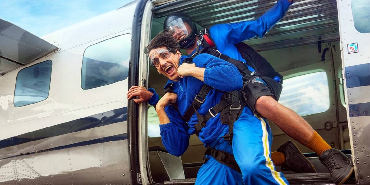 The Blakes decide to buy Andy a skydiving trip and Andy jumps out of a plane to finish off the star-studded advertisement. Picture: Tourism Australia. 