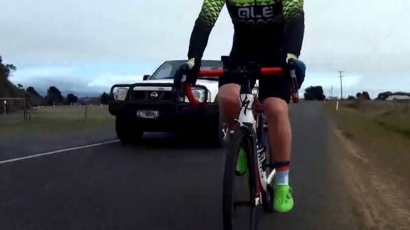 The moment a reckless driver swerves at cyclist caught on video