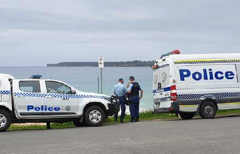 Police attend a beach at Mollymook on Saturday after members of the public found remains thought to be human. Photo: TNV