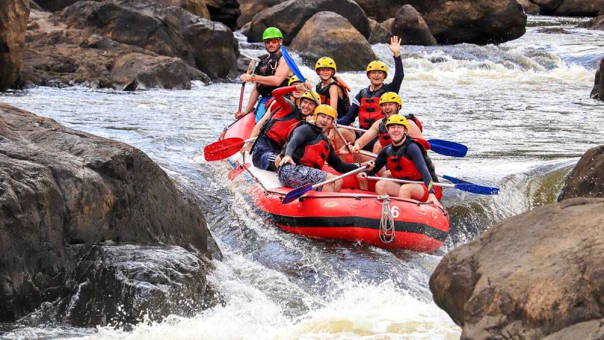 More excitement for Michael (middle right) as he rafts through the rapids at Barron River. Picture: Cairns Adventure Group
