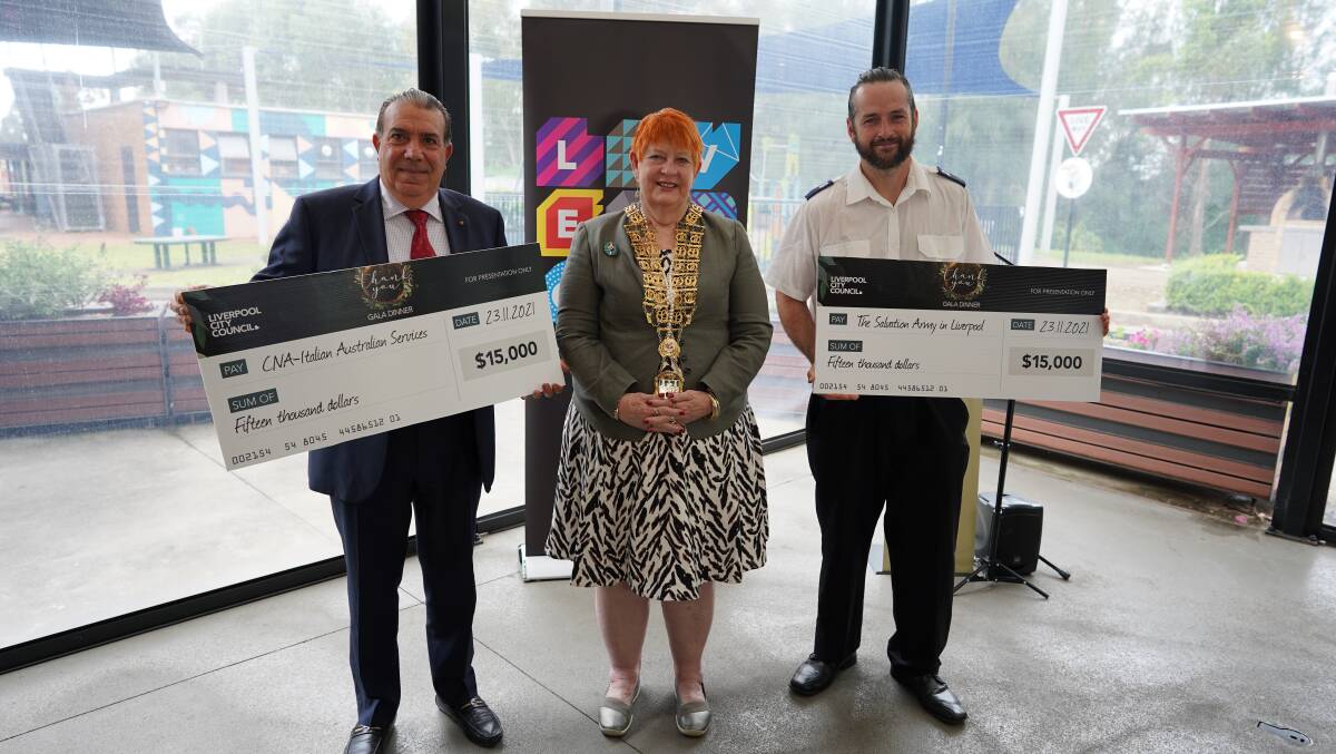 Liverpool mayor Wendy Waller presents the cheque to representatives from this years two beneficiaries Joel Spicer from The Salvation Army in Liverpool and Giovanni Testa from CNA Italian Australian Services. 