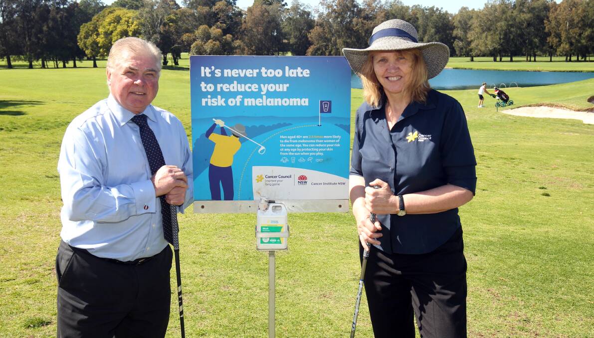 Teeing off: Liverpool Golf Club general manager Peter Summers and Cancer Council Community Relations Coordinator Denise Daynes. Picture: Chris Lane