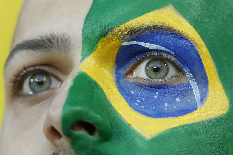 Brazil's supporter colored the face with the national flag waits for the start of the group E match between Serbia and Brazil. Photo: AP Photo/Victor R. Caivano