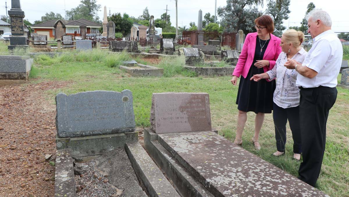 Memorial: Susan Templeman MP (left), Mary Lyons-Buckett and John Leek at the cemetery where Mr Whirlpool is buried in an unmarked grave. Picture: Supplied

