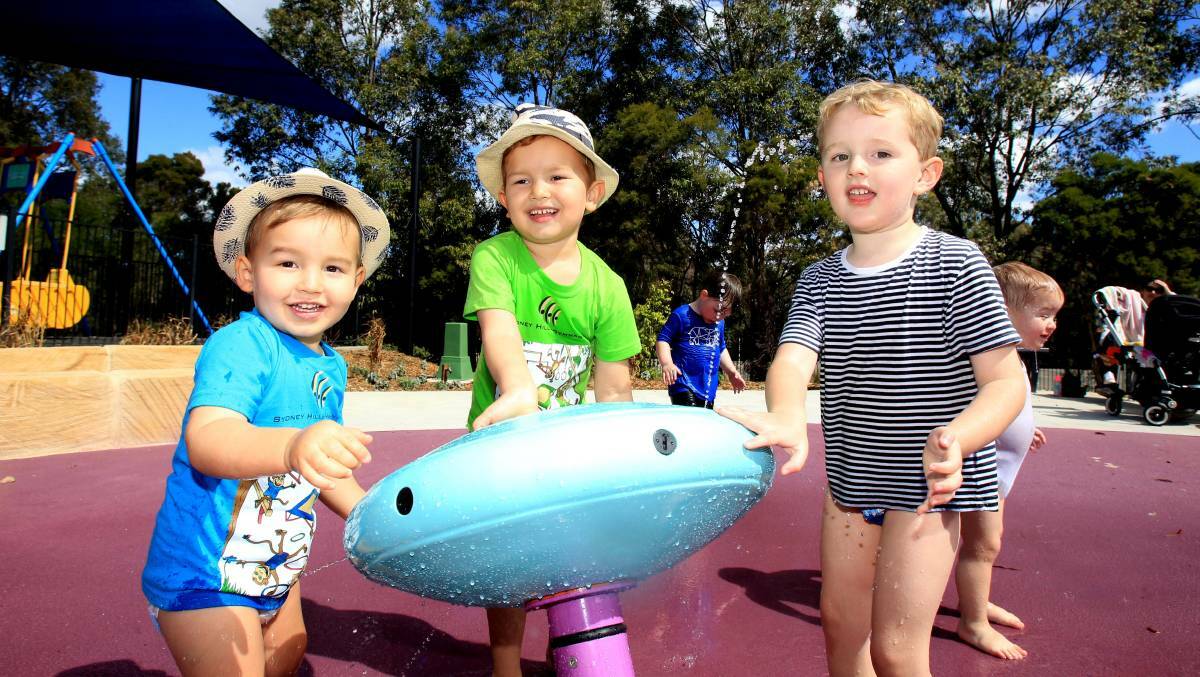 MAKING A SPLASH: Jackson, Joshua and Sam have fun in the water play area. Picture: Isabella Lettini