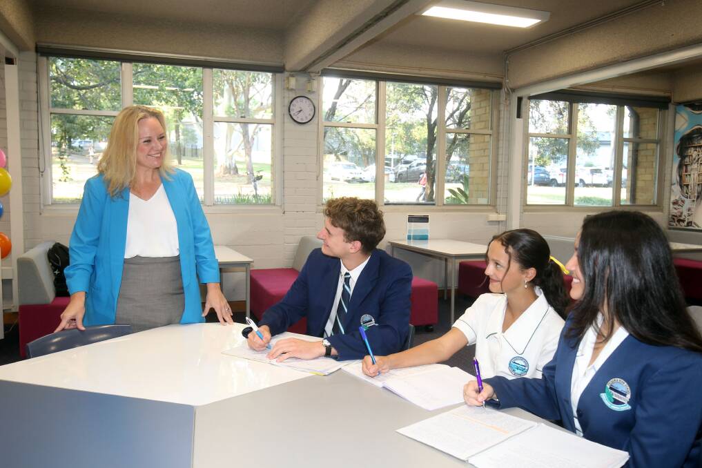 Sylvania High School students Thomas Gibson, Zoe Ormonde and Arsenia Gatziastras with principal Renee Holz. The school has improved in its HSC results by tailoring writing across all subjects. Picture by Chris Lane
