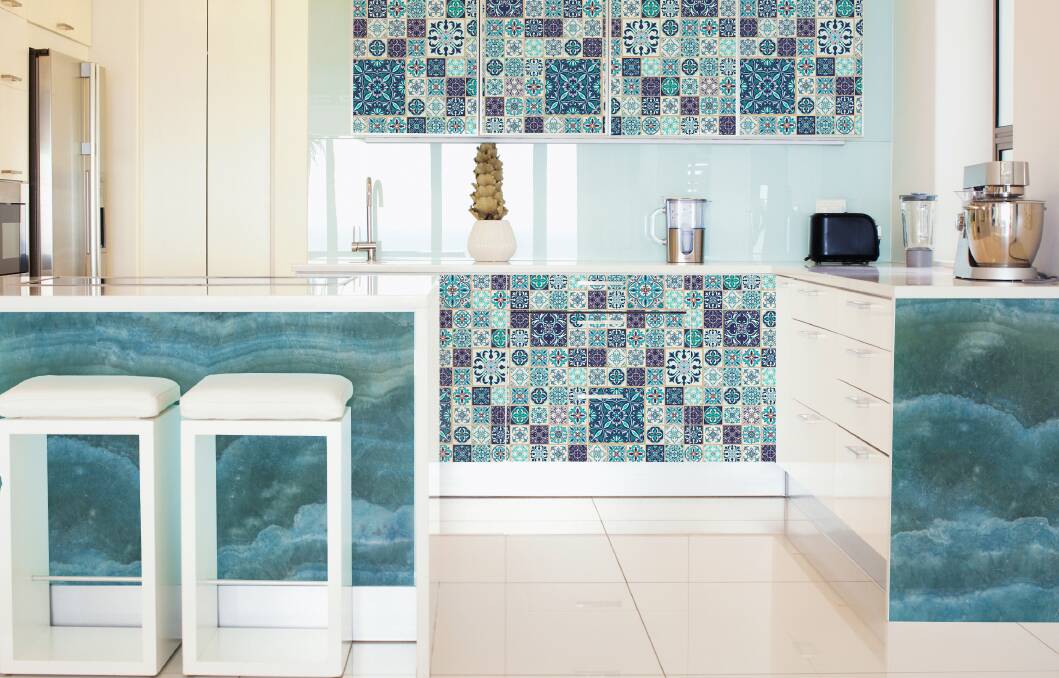 You can use very light shades of blue on one of the walls to enlarge the room or use darker blue variants on kitchen furniture elements to cool a room with lots of sun.