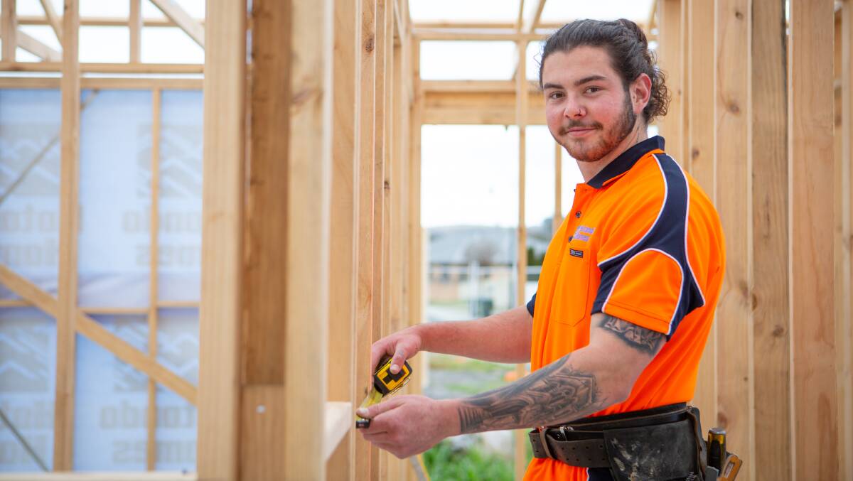 BUSY TIMES: Builder Mitch Smith working on new housing at Turners Beach. Picture: Eve Woodhouse.