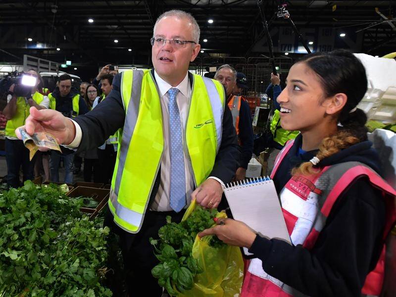 Prime Minister Scott Morrison was warmly received at Flemington markets on Thursday.