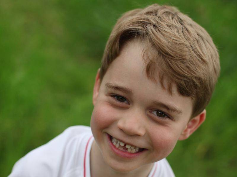 Prince George is pictured in an England football shirt in a photo to mark his sixth birthday.
