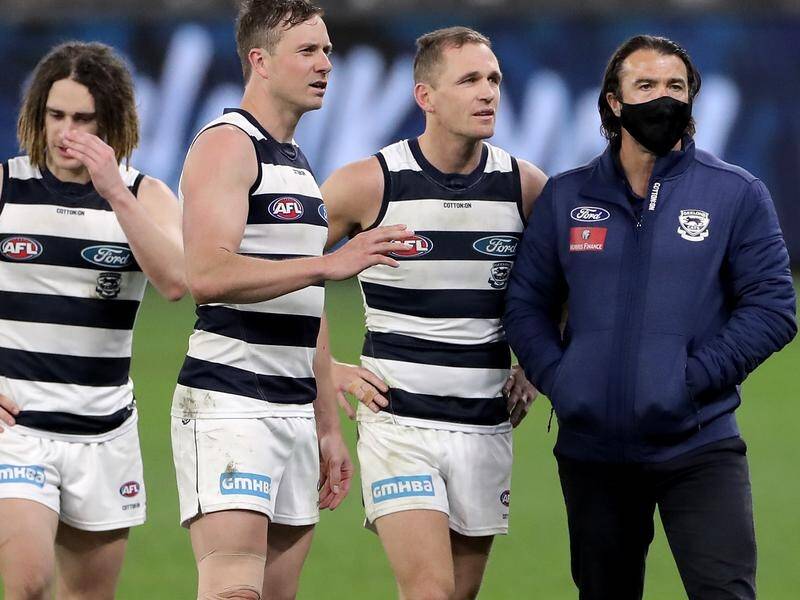 Chris Scott (r) is expected to sign a new two-year deal to remain Geelong's AFL coach.
