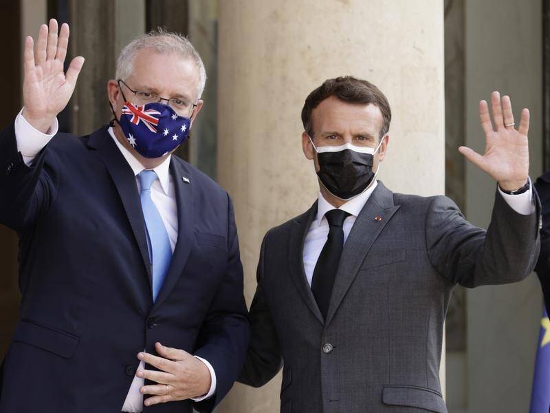 Scott Morrison has rejected claims by Emmanuel Macron (r) he 
