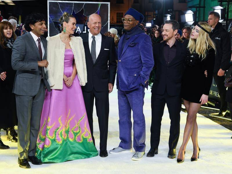 M Night Shyamalan (2nd left) has blended storylines from his past movies in his new film Glass.