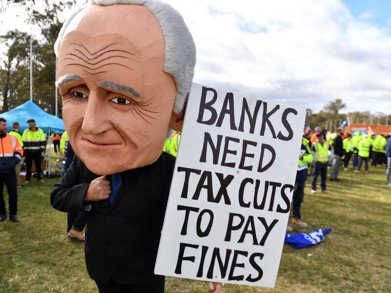 Workers and unionists have protested over wages and penalty rate cuts in front of Parliament House.