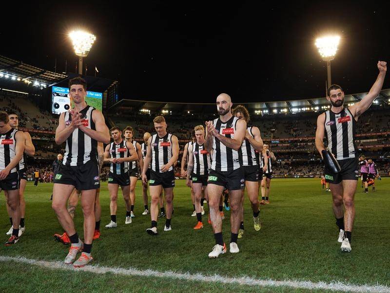 Collingwood's players trudge off in dejection after their preliminary final defeat to GWS.
