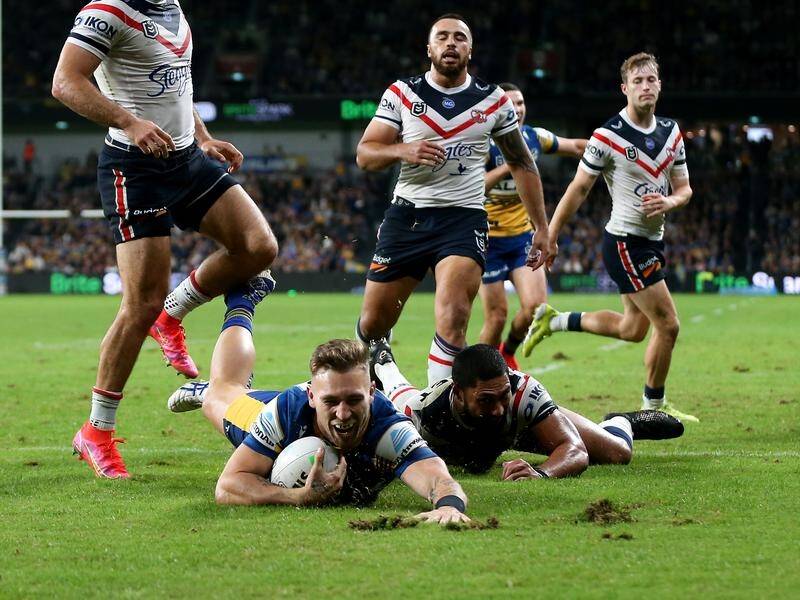 Bryce Cartwright scores one of his two tries in Parramatta's rugged NRL win over Sydney Roosters.