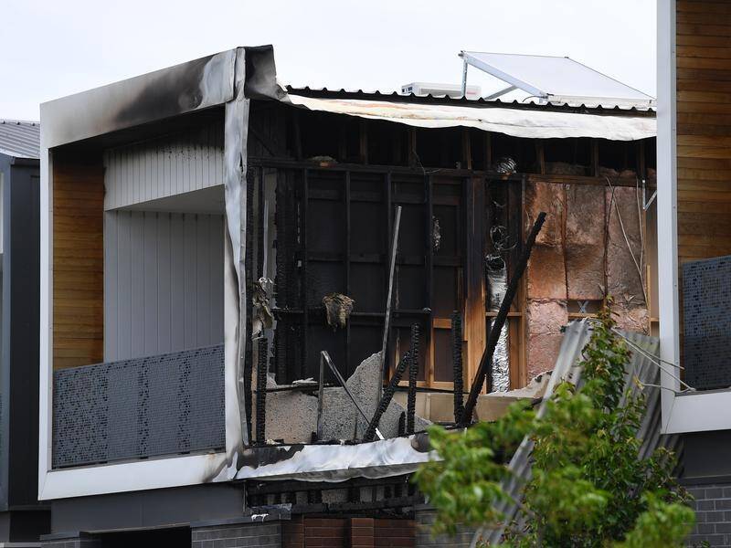 A woman has been charged with murder over a Melbourne house fire that killed a young family.