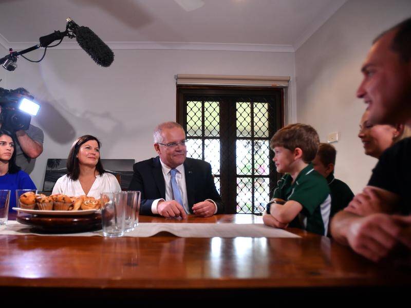 Scott Morrison met with a Cairns family saving for their first home on the last day of the campaign.